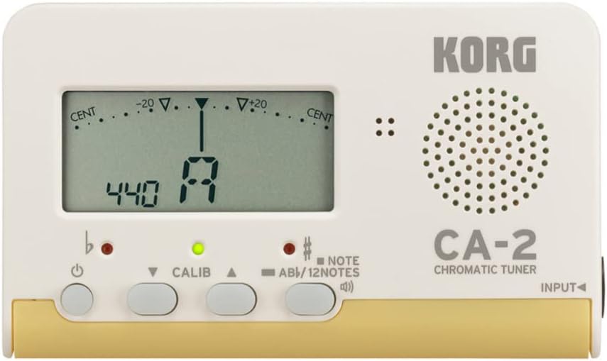 White and gold KORG CA-2 tuner showing its pitch display, three tuning lights and Sound Out button