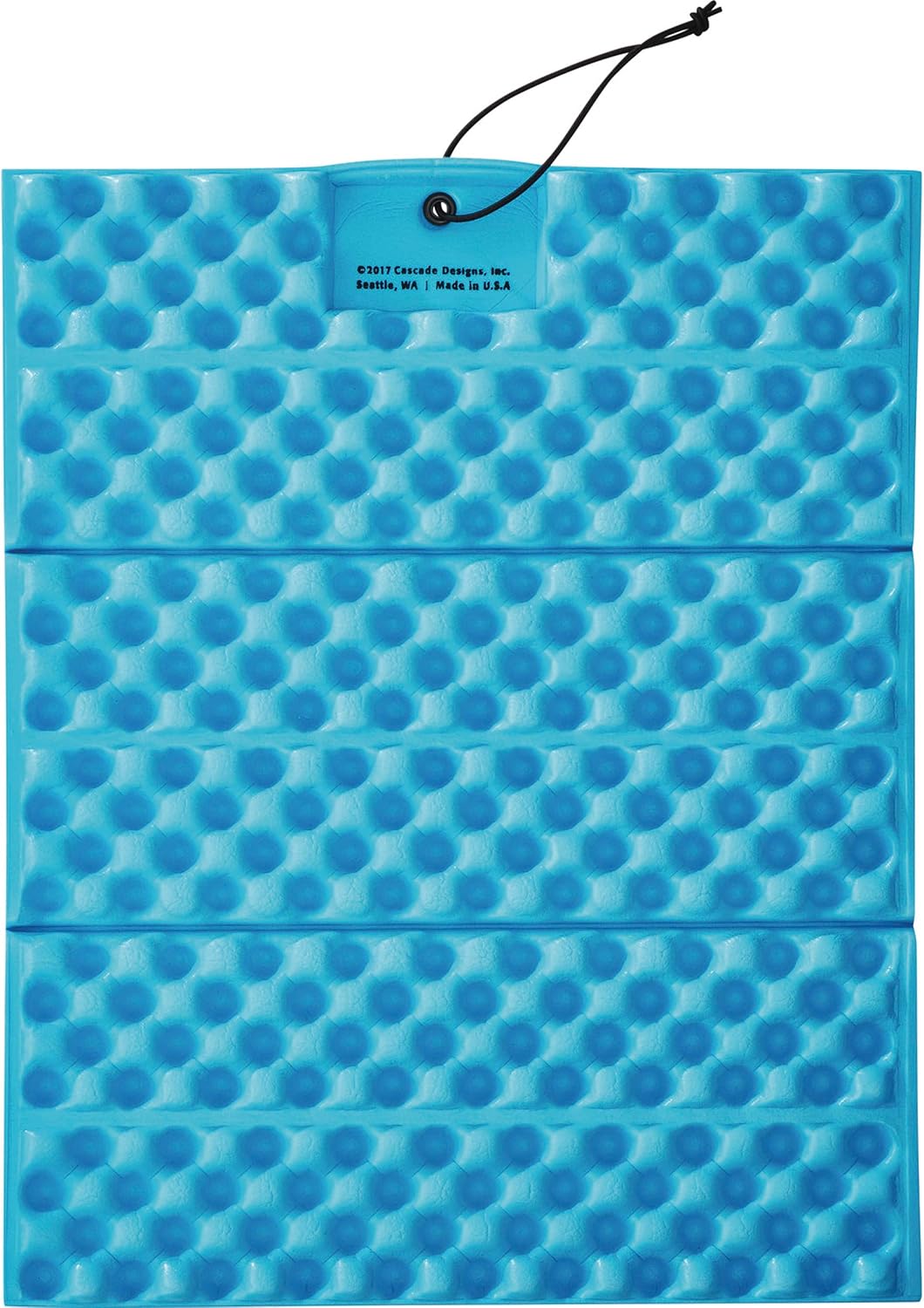 Unfolded blue side of a Therm-a-Rest Z Seat with molded foam texture, accordion creases and a black bungee cord