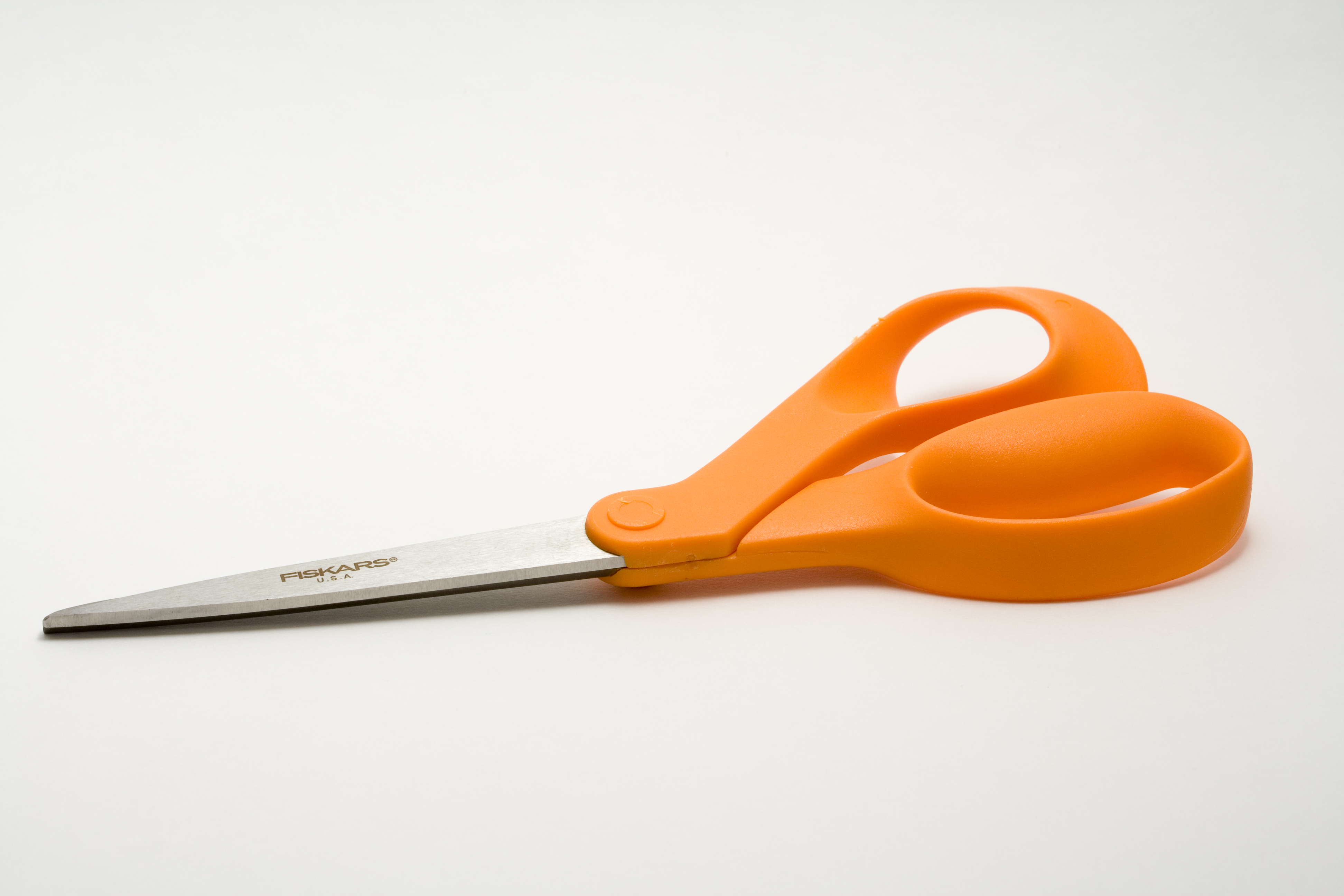 Fiskars orange-handled Original-design scissors, low side view with raised handle