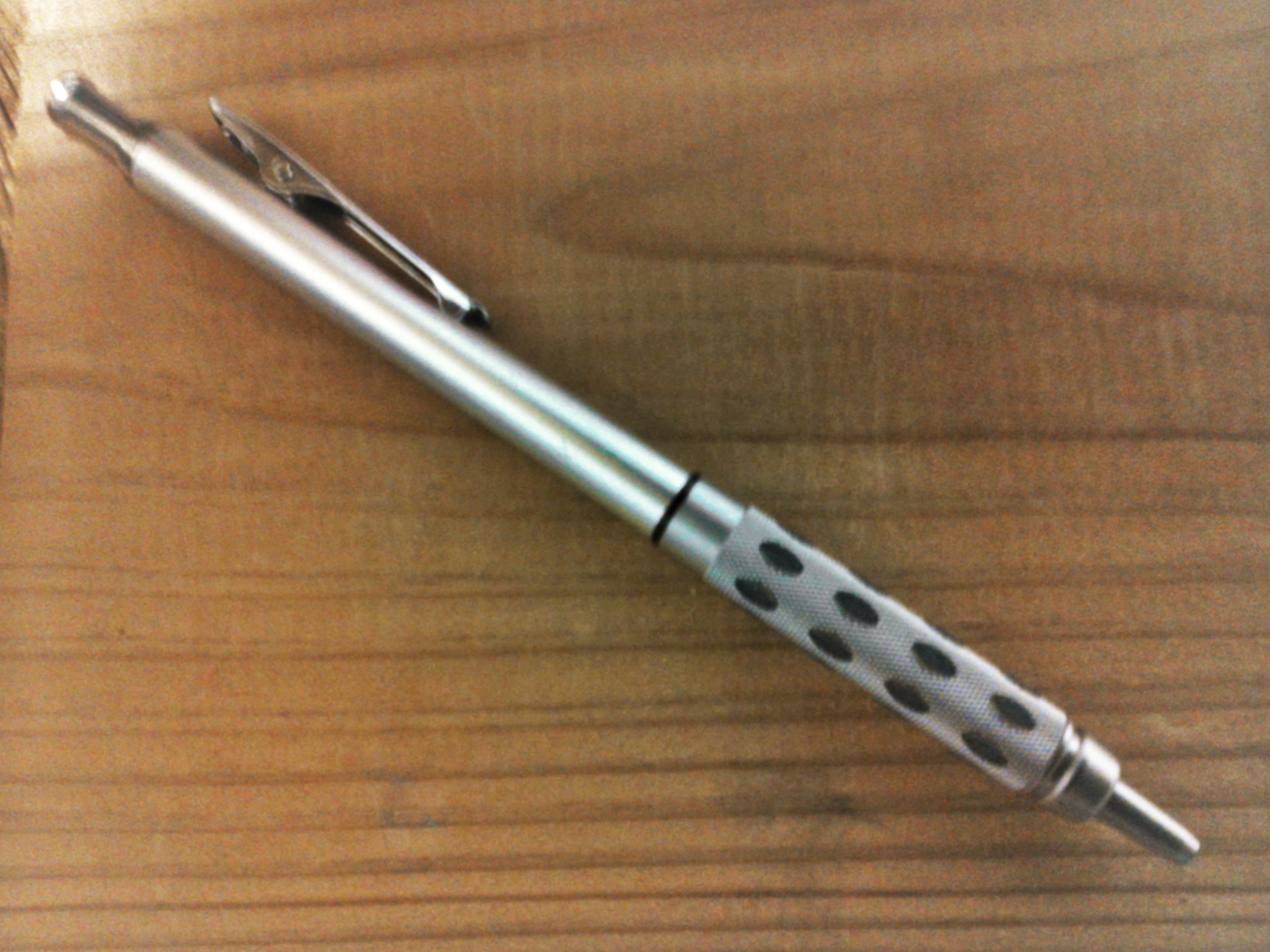 Pentel GraphGear 1000 on a desk with the narrow front tip retracted.
