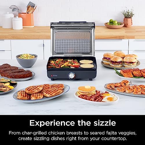 Ninja Sizzle GR101 on a kitchen counter using the flat griddle plate for a mixed meal