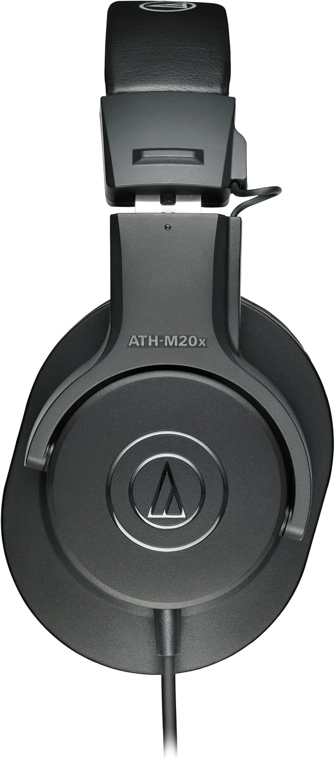 Side view of black ATH-M20x showing closed earcup, adjustable band and fixed cable exit