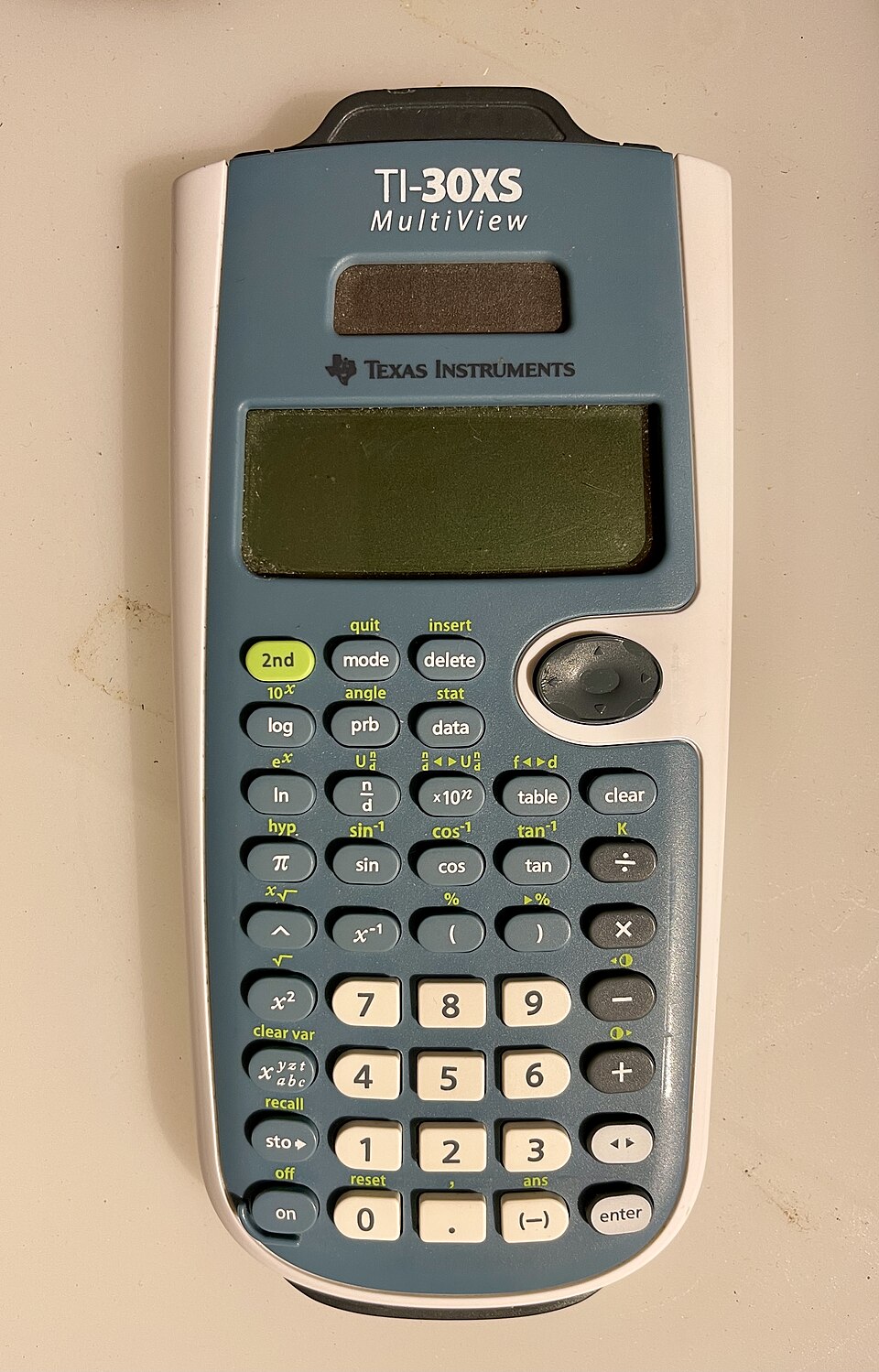 Blue-and-white TI-30XS MultiView with fraction, table, and arrow keys visible.