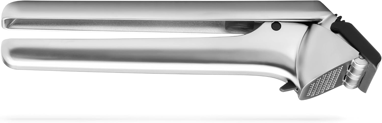 Closed black-accent Dreamfarm Garject DFGA5516 metal garlic press on a white background