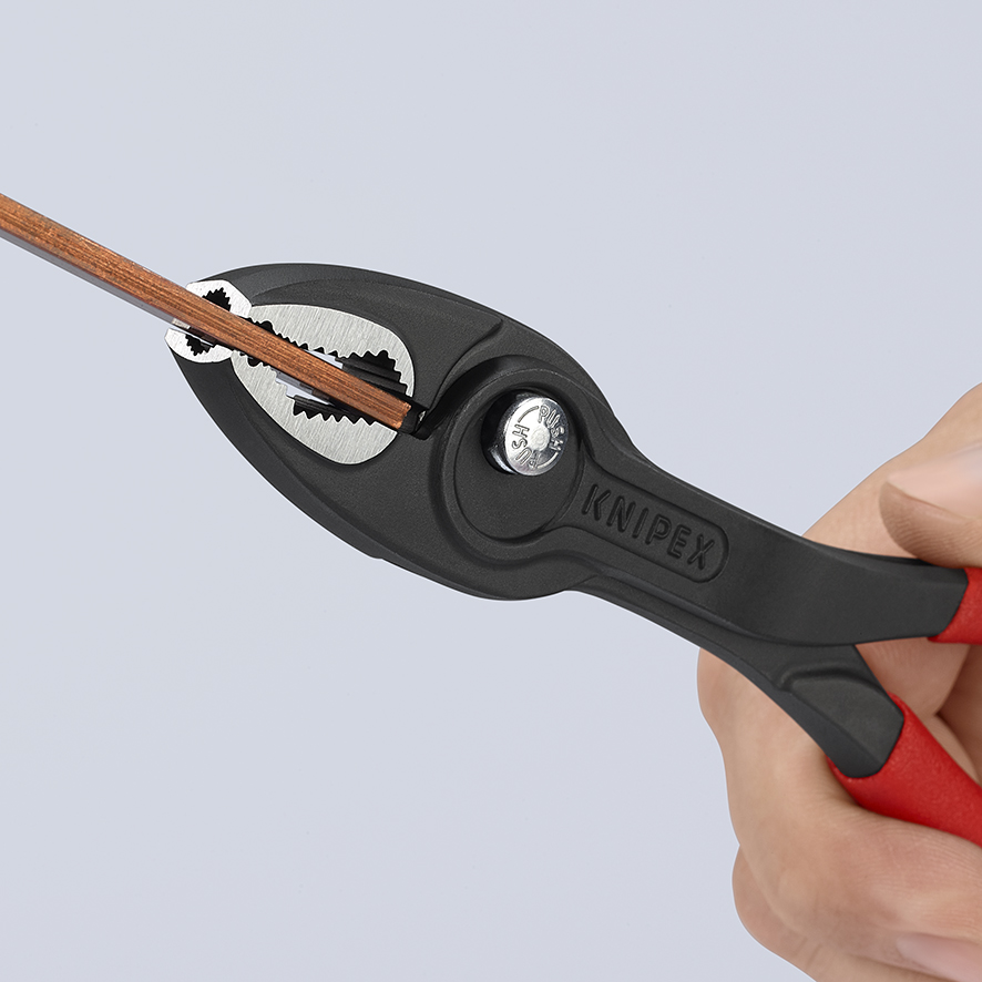 Close view of KNIPEX 82 01 200 TwinGrip front jaws gripping a worn screw head