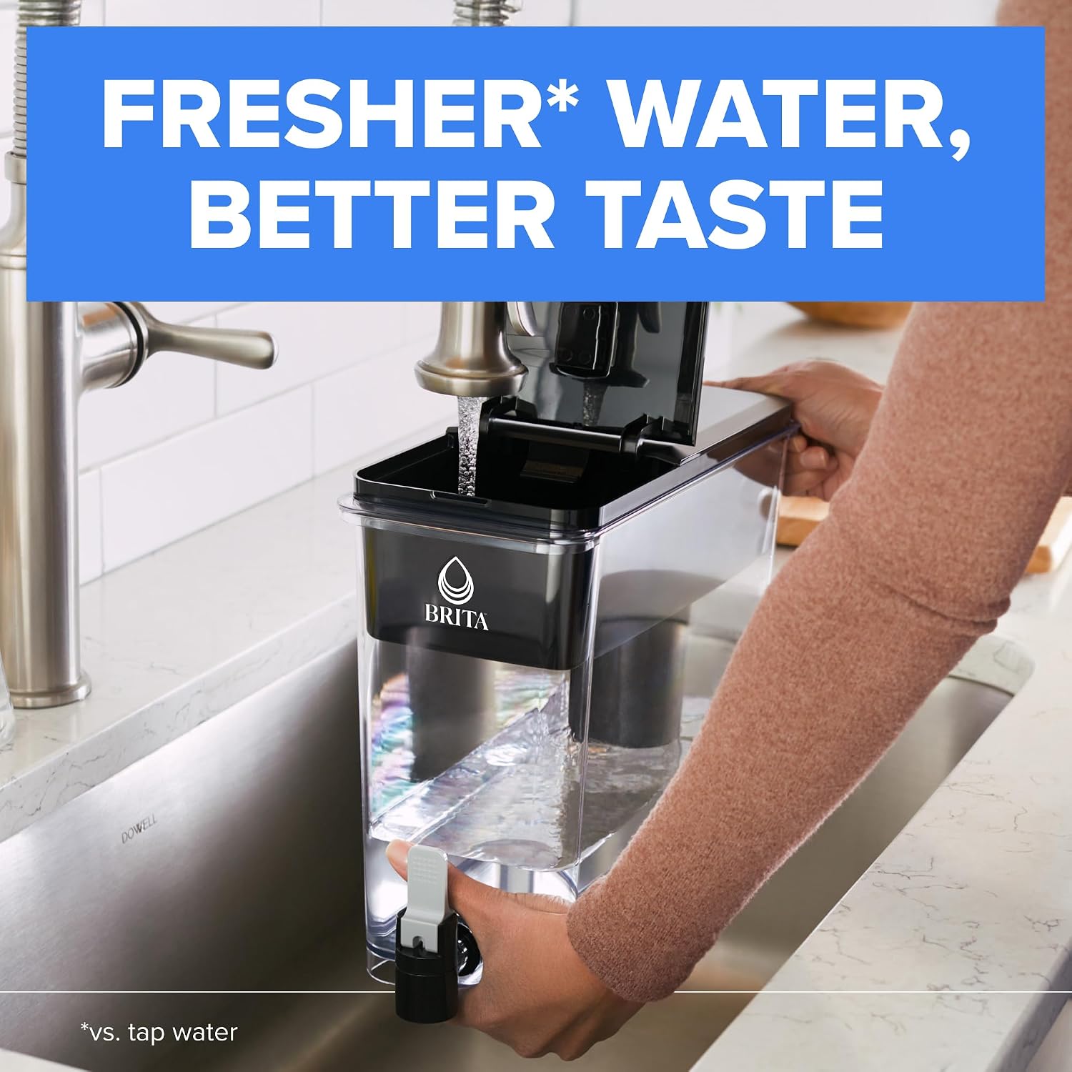 Supplier image of the black Brita UltraMax being filled under a sink faucet with its top flip lid open