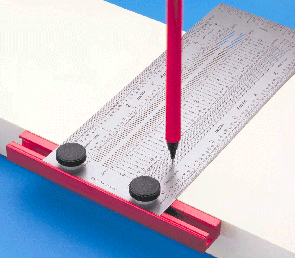 Pencil point inside the guided marking field of the exact INCRA T-RULE06 while its red T-bar rests on a workpiece edge