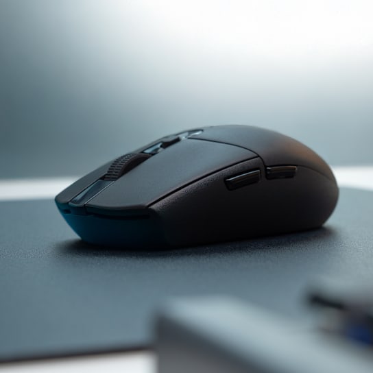 Black Logitech G305 LIGHTSPEED side view showing the two left-side buttons