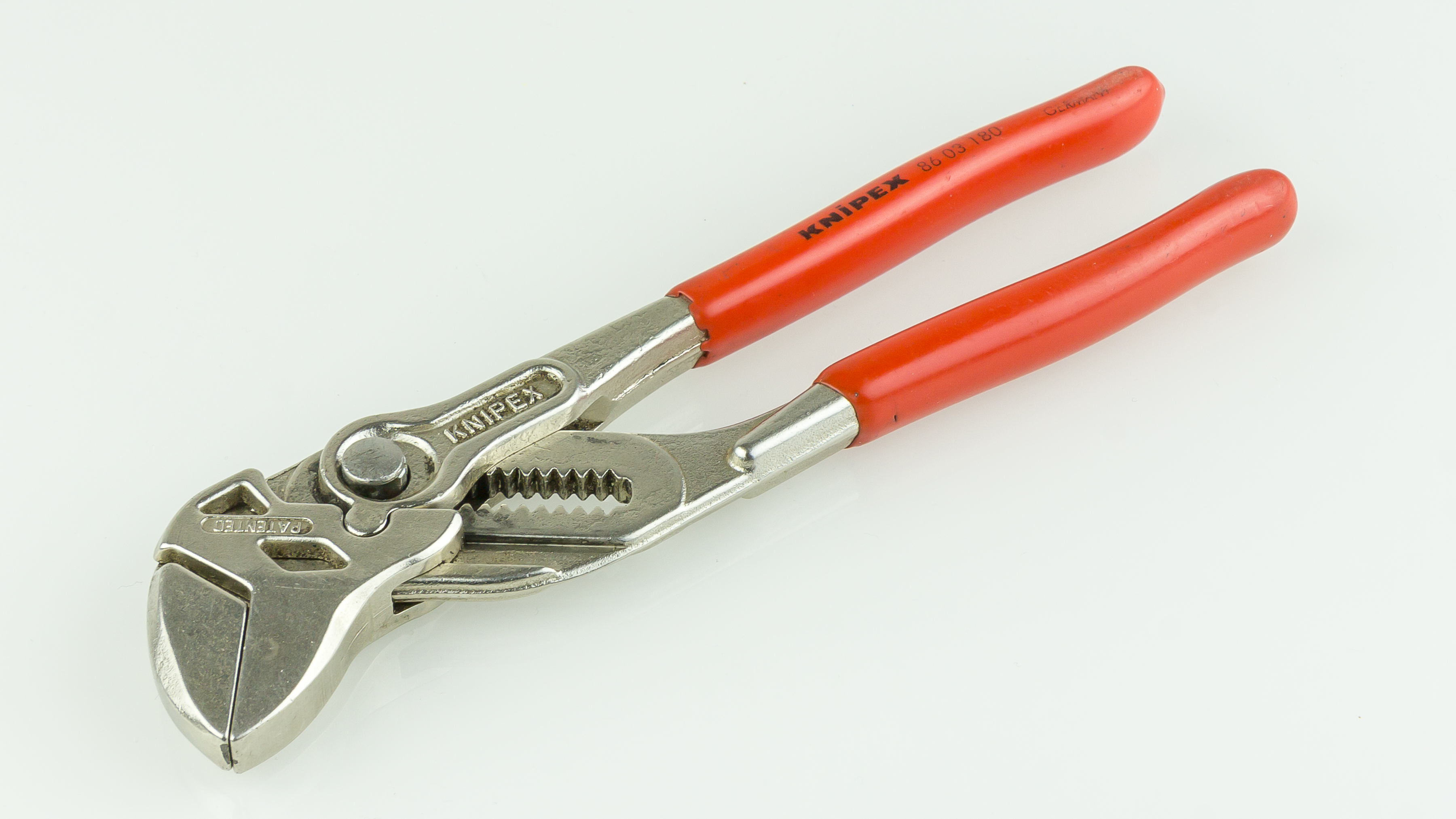 KNIPEX 86 03 180 chrome-plated Pliers Wrench opened to show its longer handles, joint, and smooth jaw faces