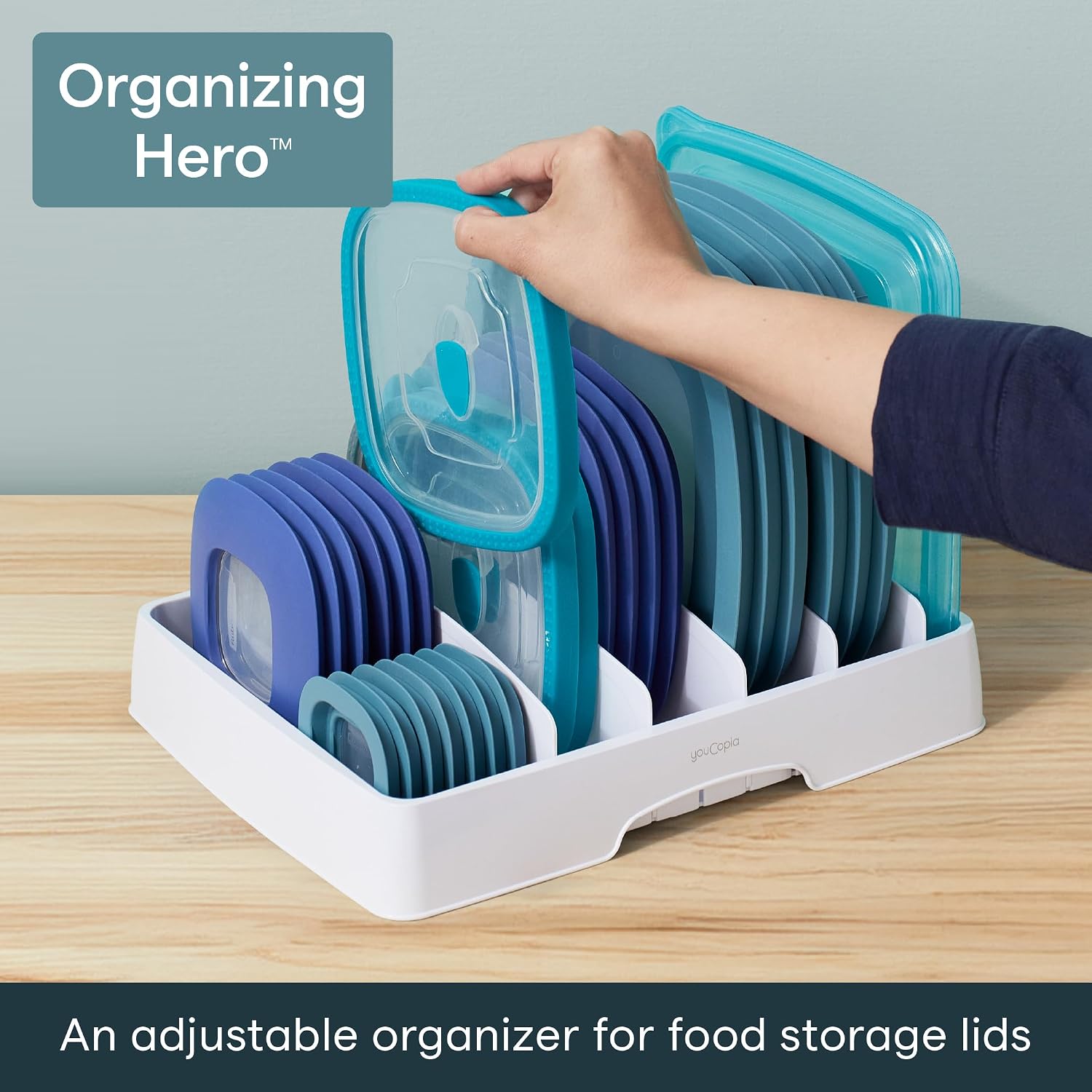 Hand removing a rectangular lid from the exact YouCopia 50100 StoraLid classic organizer