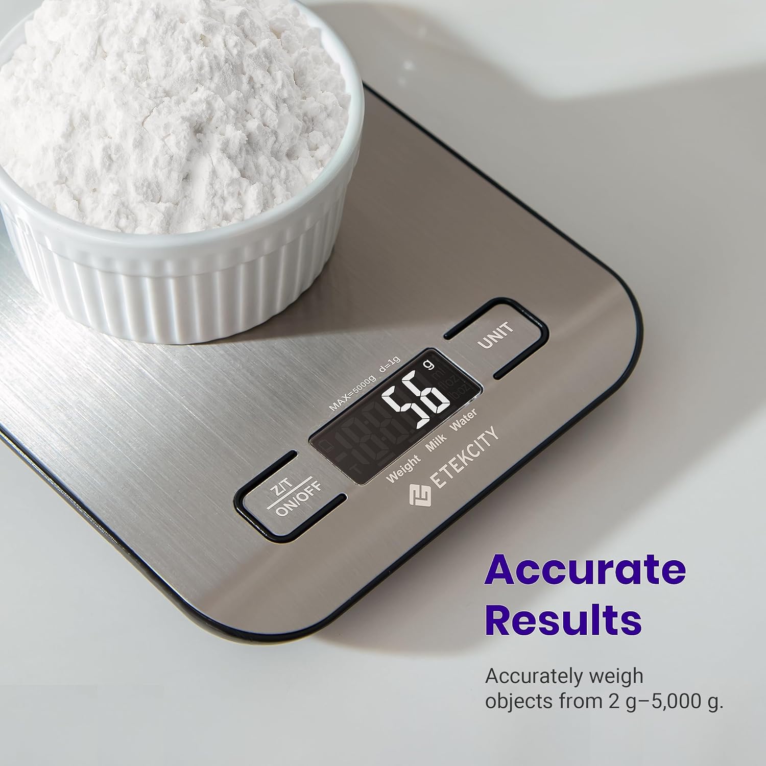 Etekcity scale holding a white bowl of powder, with 56 g displayed and supplier accuracy wording beside it.