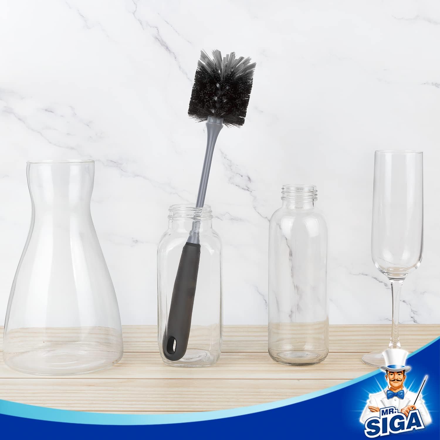 MR.SIGA bottle brush beside glassware with its handle resting in a jar