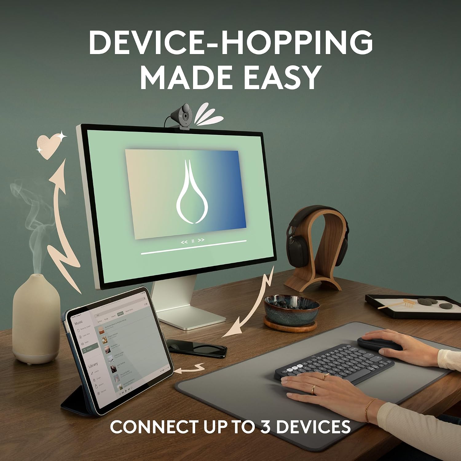 Black Logitech Pebble Mouse 2 M350s in a multi-device desktop setup