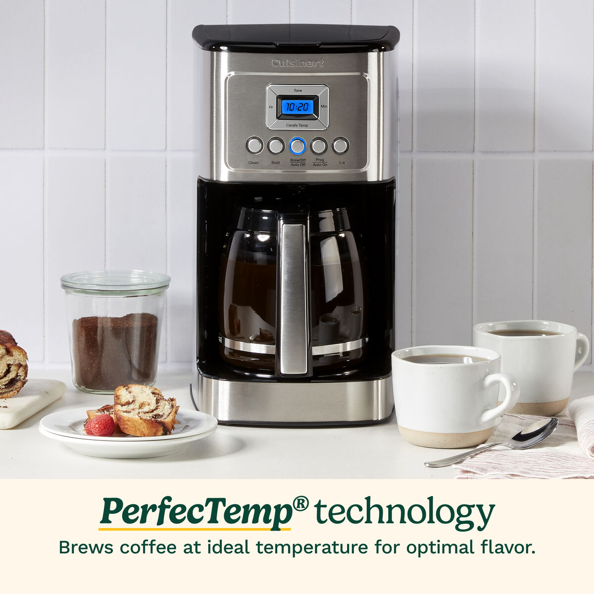 Cuisinart DCC-3200 stainless coffee maker on a counter with glass carafe and cups