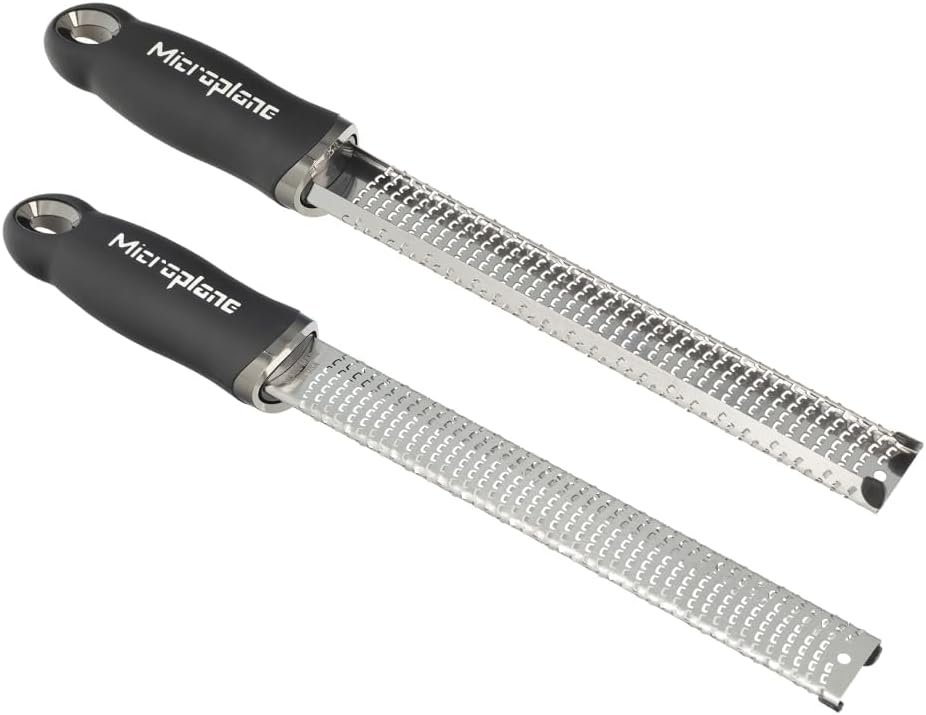 Two angled views of the black Microplane Premium Classic Series Zester